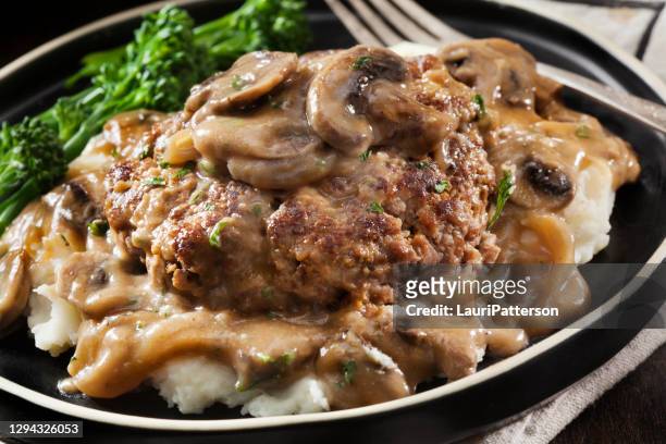 salisbury steak in a rich mushroom and onion gravy with mashed potatoes - comfort food stock pictures, royalty-free photos & images