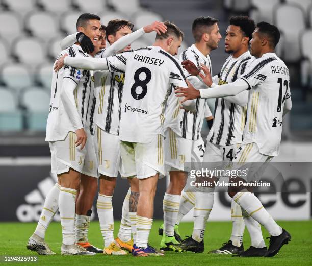 Cristiano Ronaldo of Juventus F.C. Celebrates with teammates Aaron Ramsey, Weston McKennie and Alex Sandro after scoring their team's first goal...