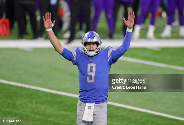 Matthew Stafford of the Detroit Lions celebrates a touchdown during the fourth quarter of the game against the Minnesota Vikings at Ford Field on...