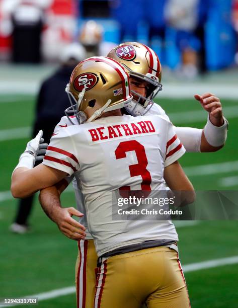 Quarterback C.J. Beathard hugs teammate quarterback Josh Rosen of the San Francisco 49ers before the game against the Seattle Seahawks at State Farm...