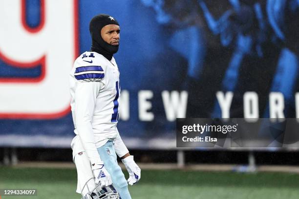 Cedrick Wilson of the Dallas Cowboys walks off the field following his teams 23-19 defeat against the New York Giants at MetLife Stadium on January...