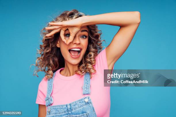 close-up portrait of smiling girl - ok sign stock pictures, royalty-free photos & images