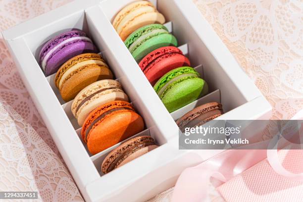 macaroons in different colours as the gift on valentine's day. - kokosmakroon stockfoto's en -beelden