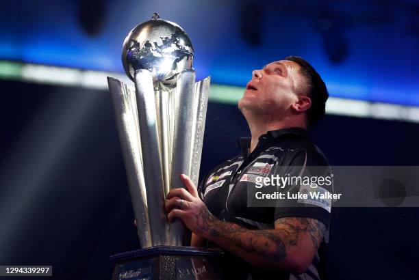 Gerwyn Price of Wales poses with the trophy during the Finals against Gary Anderson of Scotlandduring Day Sixteen of The PDC William Hill World Darts...