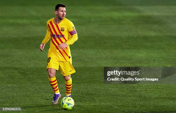 Lionel Messi of FC Barcelona runs with the ball during the La Liga Santander match between SD Huesca and FC Barcelona at Estadio El Alcoraz on...