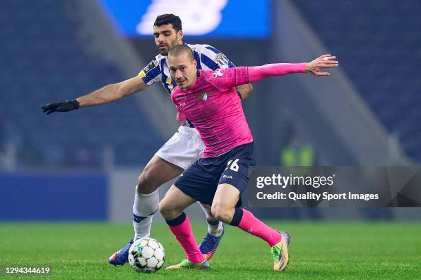 Mehdi Taremi of FC Porto competes for the ball with Alex Soares of Moreirense FC during the Liga NOS match between FC Porto and Moreirense FC at...