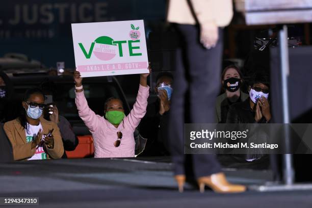 Supporters listen to Vice President-elect Kamala Harris speak during a drive-in rally at Garden City Stadium on January 03, 2021 in Savannah,...