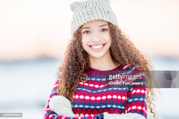 portrait of beautiful female teenager in the snow - 15 year old model stock pictures, royalty-free photos & images