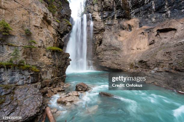 hiking at johnson canyon in banff national park, canada - banff national park stock pictures, royalty-free photos & images