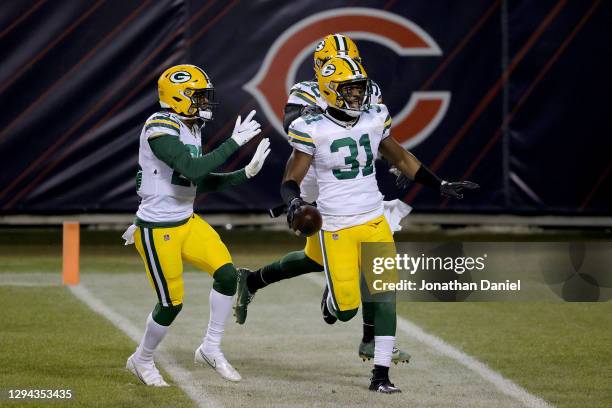 Adrian Amos of the Green Bay Packers celebrates with his teammates after intercepting a pass by Mitchell Trubisky of the Chicago Bears during the...