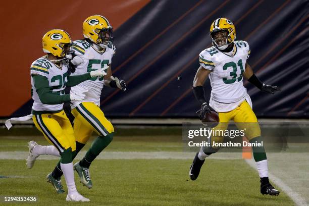 Adrian Amos of the Green Bay Packers celebrates with his teammates after intercepting a pass by Mitchell Trubisky of the Chicago Bears during the...