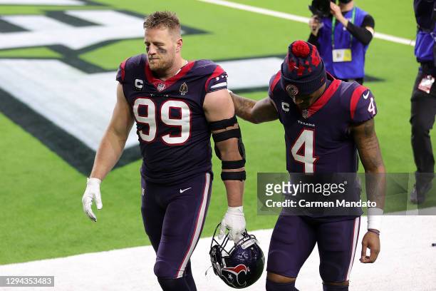 Watt of the Houston Texans walks off the field with Deshaun Watson following a game against the Tennessee Titans at NRG Stadium on January 03, 2021...
