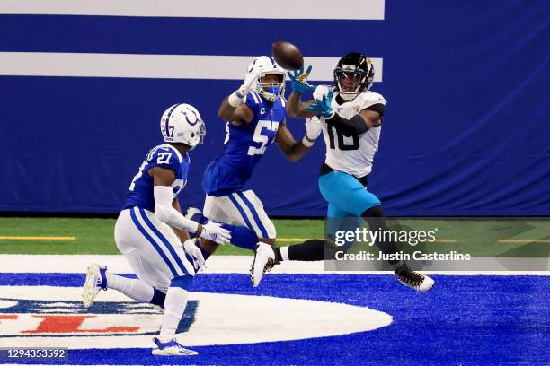 Laviska Shenault Jr. #10 of the Jacksonville Jaguars catches a pass for a touchdown against Darius Leonard and Xavier Rhodes of the Indianapolis...