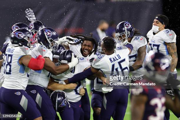 Sam Sloman of the Tennessee Titans celebrates a field goal to win the game against the Houston Texans at NRG Stadium on January 03, 2021 in Houston,...