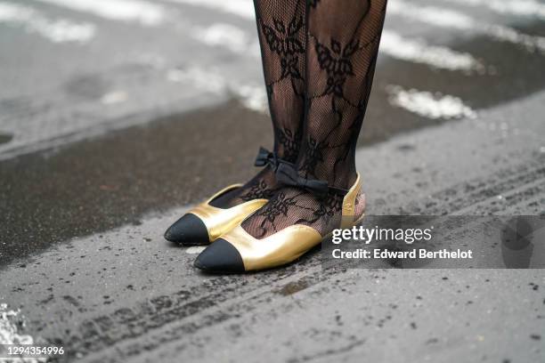 Alba Garavito Torre wears mesh floral print tights, golden flat ballerina Chanel pointy shoes with black tips, on December 22, 2020 in Paris, France.