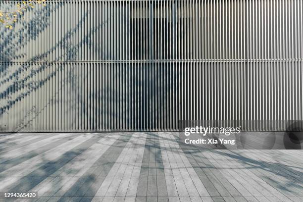 empty ground in front of modern office building - modern facade stock pictures, royalty-free photos & images