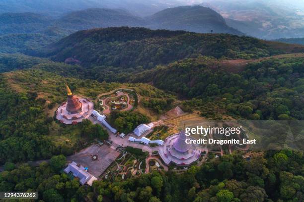 aerial view (drone shot) of sunrise scence of two pagoda on the top of inthanon mountain in doi inthanon national park, chiang mai, thailand - chiang mai province stock pictures, royalty-free photos & images