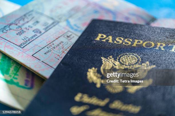 close-up of american passport - travel documents stock-fotos und bilder