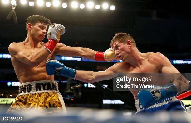 Ryan Garcia and Luke Campbell exchange punches during the WBC Interim Lightweight Title fight at American Airlines Center on January 02, 2021 in...