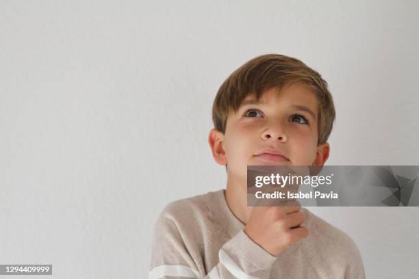 thoughtful boy - dumb blonde stock pictures, royalty-free photos & images