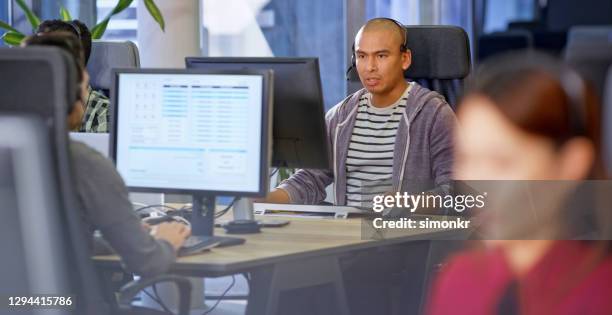 customer service representatives working in call centre - hairless mouse stock pictures, royalty-free photos & images
