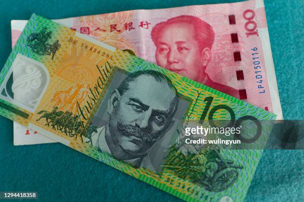 one hundred paper currency, chinese and australian - australian dollar foto e immagini stock