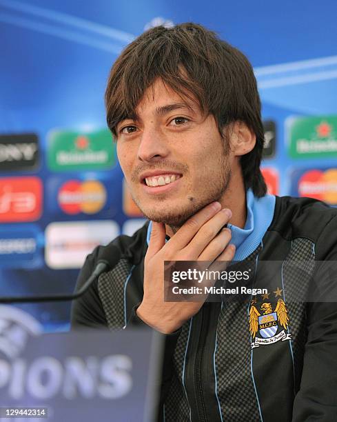 David Silva of Manchester City looks on during a press conference ahead of their UEFA Champions League Group A match against Villarreal at the...