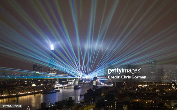 Laser show replaces the usual New Years Eve firework display by Tower Bridge due to the Covid 19 restrictions on January 01,2021 in London, England.