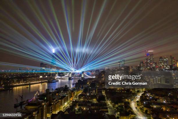 Laser show replaces the usual New Years Eve firework display by Tower Bridge due to the Covid 19 restrictions on January 01,2021 in London, England.