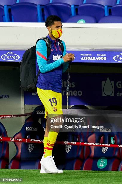 Matheus Fernandes of FC Barcelona wearing a face mask as he arrives on the pitch prior to the La Liga Santander match between SD Huesca and FC...