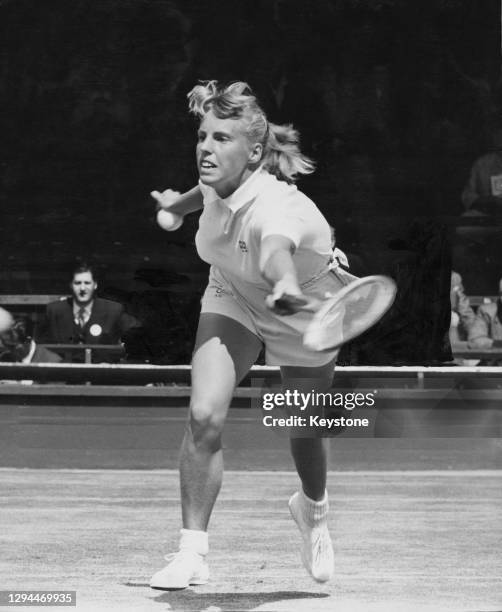 Ann Haydon of Great Britain reaches to make a forehand return shot to Karen Hantze of the United States during their singles match of the 32nd...