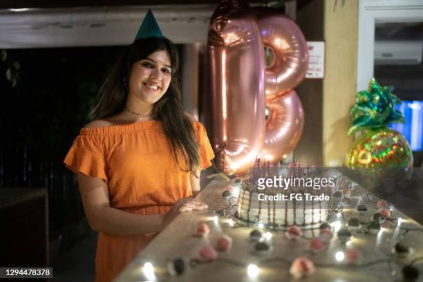portrait of a teenager woman on her birthday party - 18 years stock pictures, royalty-free photos & images