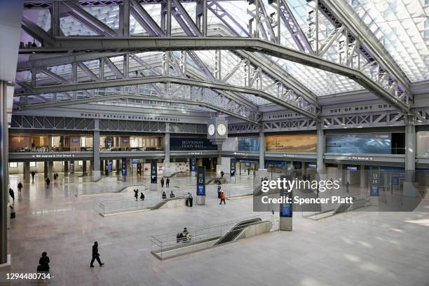 People walk through the newly opened Moynihan Train Hall in Manhattan on January 04, 2021 in New York City. The facility, which was designed by...