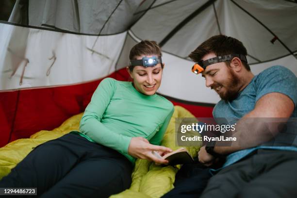 couple on hiking adventure in the pacific northwest - head torch stock pictures, royalty-free photos & images