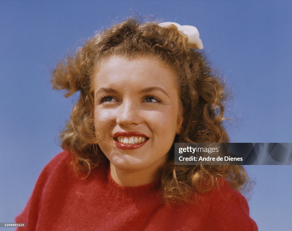 Portrait Of American Actress And Model Marilyn Monroe In A Red portrait-of-american-actress-and-model-marilyn-monroe-in-a-red