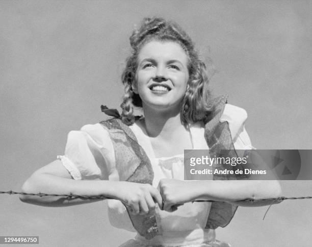 Portrait of American actress and model Marilyn Monroe in a pinafore dress, Northern California, 1945.