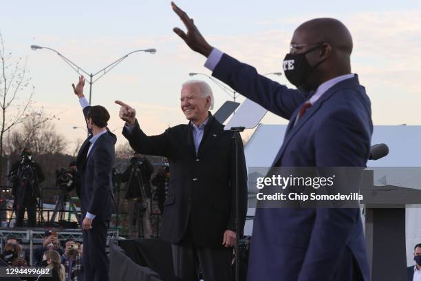 President-elect Joe Biden along with democratic candidates for the U.S. Senate Jon Ossoff and Rev. Raphael Warnock greet supporters during a campaign...