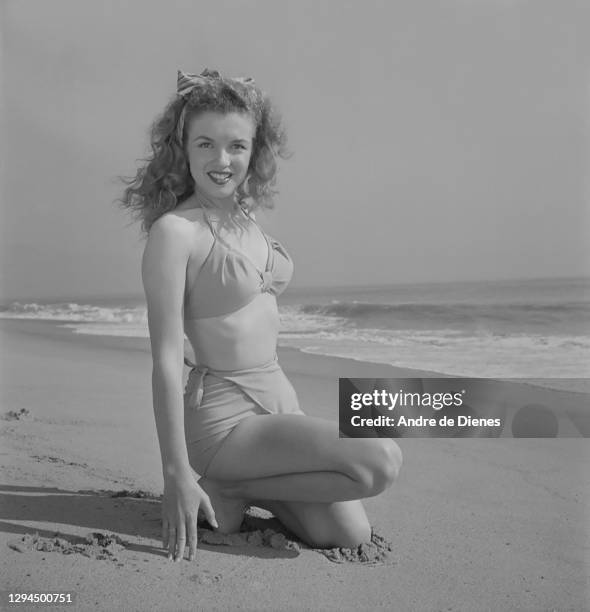 Portrait of American actress and model Marilyn Monroe in a bikini, as she poses at Zuma Beach's Paradise Cove, California, 1945.