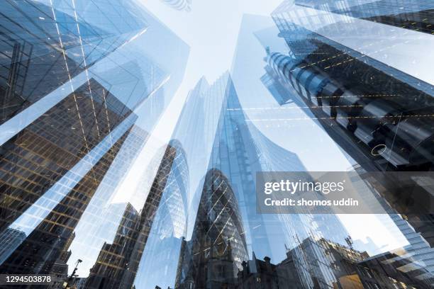 double exposure of futuristic skyscrapers in london city - banker doppelbelichtung stock-fotos und bilder