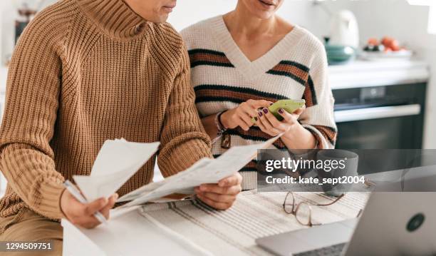 financial concept of family budget - hands paper family stock pictures, royalty-free photos & images