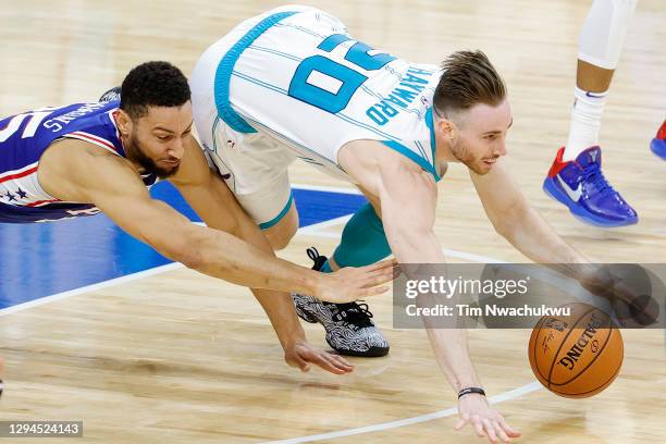 Gordon Hayward of the Charlotte Hornets and Ben Simmons of the Philadelphia 76ers dive for a loose ball during the third quarter at Wells Fargo...