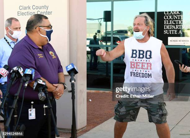 Protester interrupts a news conference to discuss ballot counting by Clark County Registrar of Voters Joe Gloria at the Clark County Election...