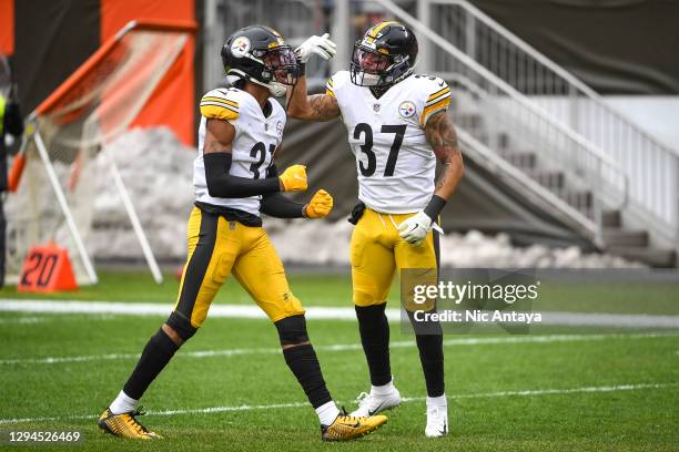 Justin Layne of the Pittsburgh Steelers and Jordan Dangerfield of the Pittsburgh Steelers celebrate during the first quarter at FirstEnergy Stadium...