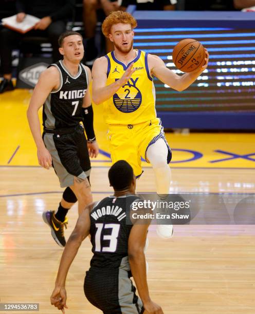 Nico Mannion of the Golden State Warriors dribbles past Kyle Guy of the Sacramento Kings at Chase Center on January 04, 2021 in San Francisco,...