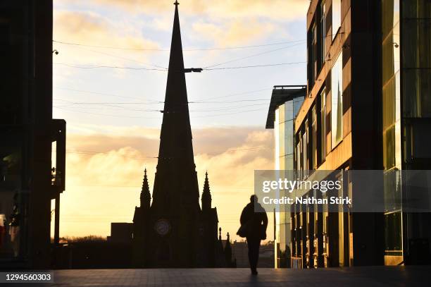 Man walks past St Martins Church in Birmingham during the nationwide lockdown on January 05, 2021 in Birmingham, England. British Prime Minister made...