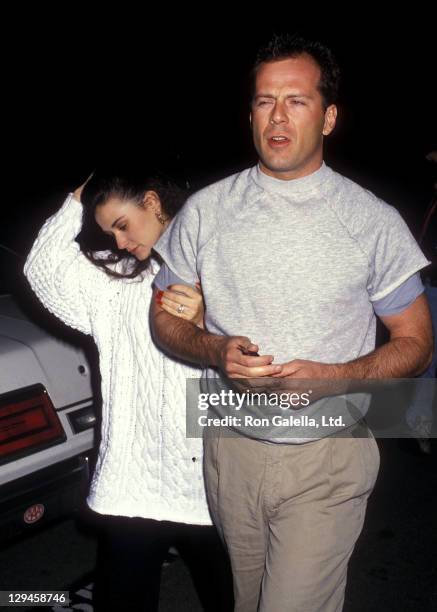 Actress Demi Moore and actor Bruce Willis attend the "And God Created Woman" Century City Premiere on March 1, 1988 at 20th Century Fox Studios in...