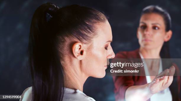 businesswoman slapping her colleague - slapping stock pictures, royalty-free photos & images