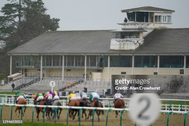General view as runners race towards the finish during The Get Your Ladbrokes Daily Odds Boost Handicap with the empty grandstands behind at...