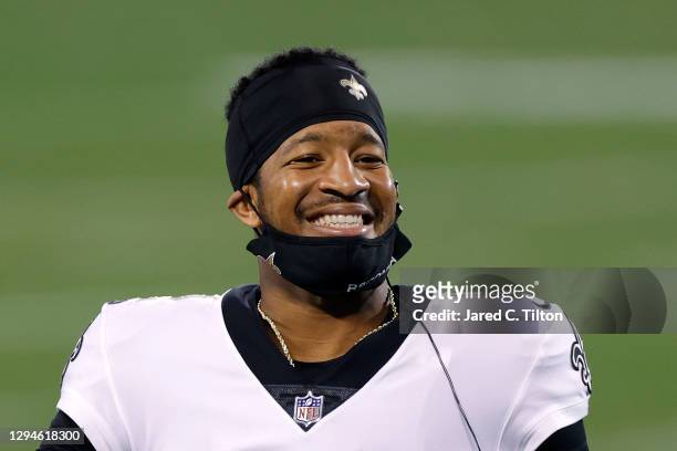 Quarterback Jameis Winston of the New Orleans Saints shares a smile during the second half of their game against the Carolina Panthers at Bank of...