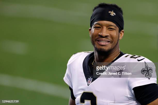 Quarterback Jameis Winston of the New Orleans Saints shares a smile following their game against the Carolina Panthers at Bank of America Stadium on...
